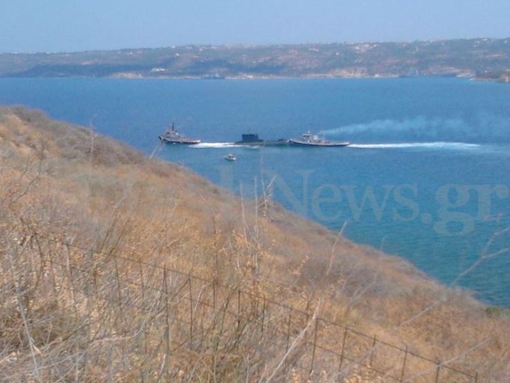 Two tugs assits the grounded submarine Proteus. Photo: Flashnews.gr